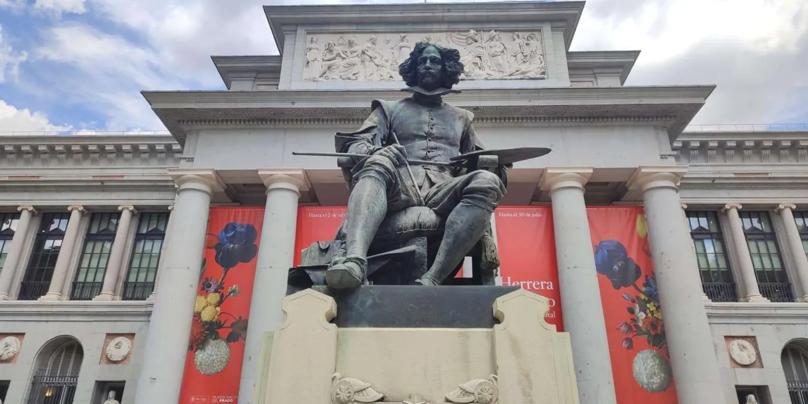 Velázquez statue in front of the Prado columns