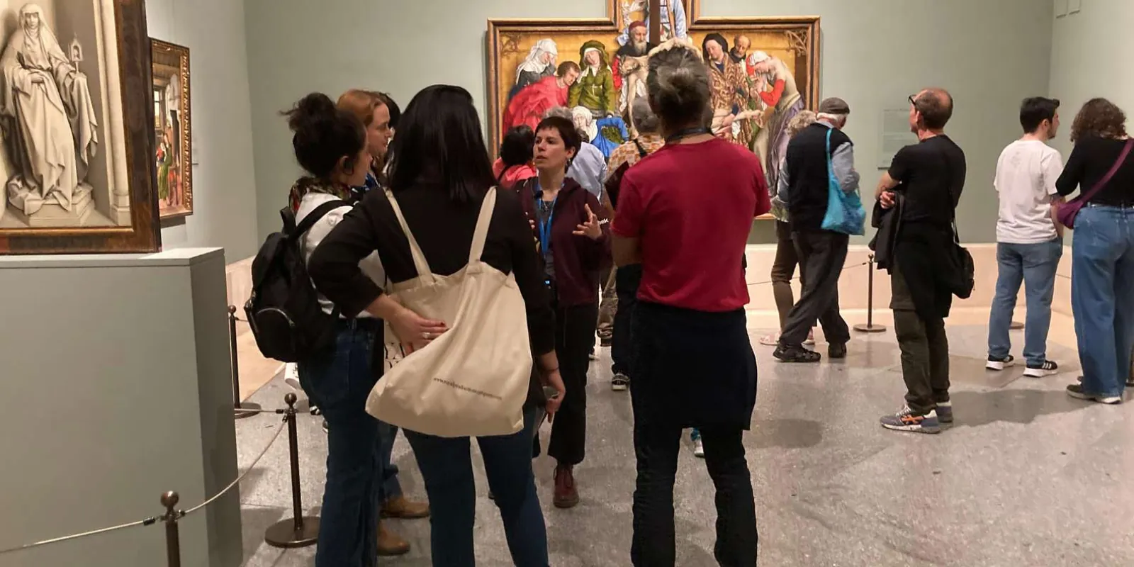 Group looking at a painting inside the Prado