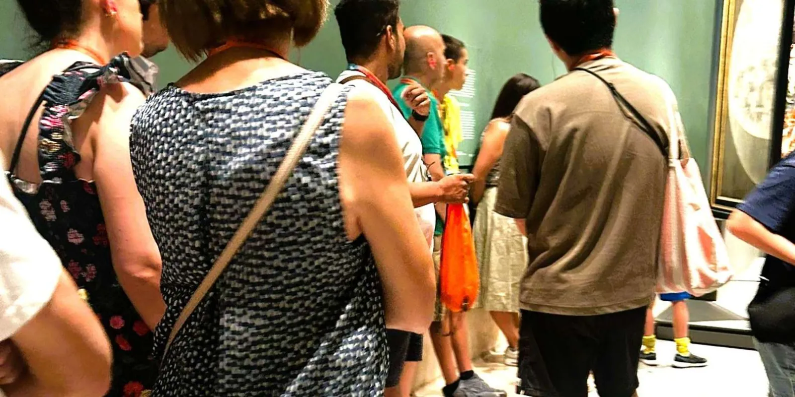 Small party viewing paintings inside the museum